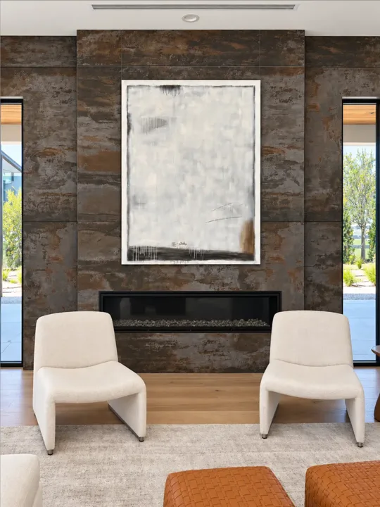 Dark stone fireplace framed by wood paneling