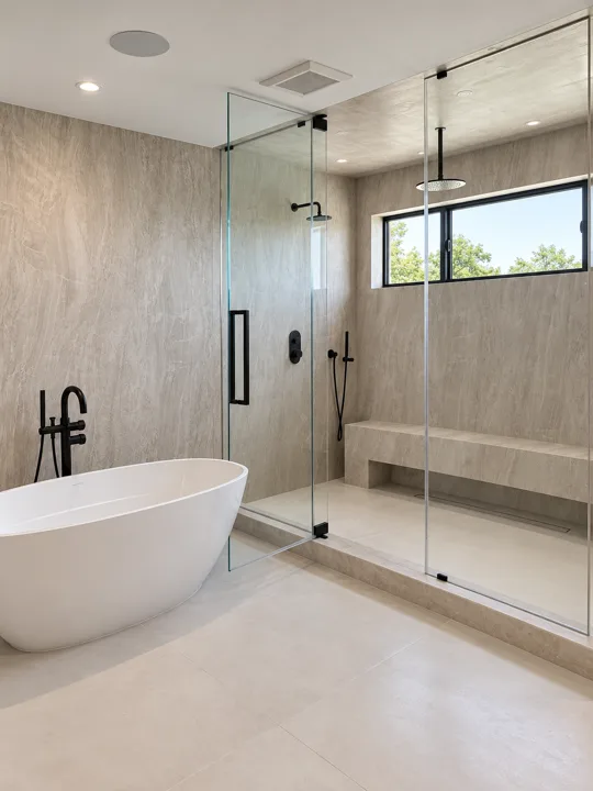 Freestanding tub beside a walk-in shower