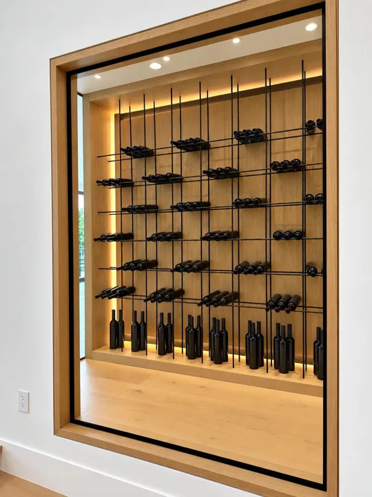 Backlit wine display with black metal racks