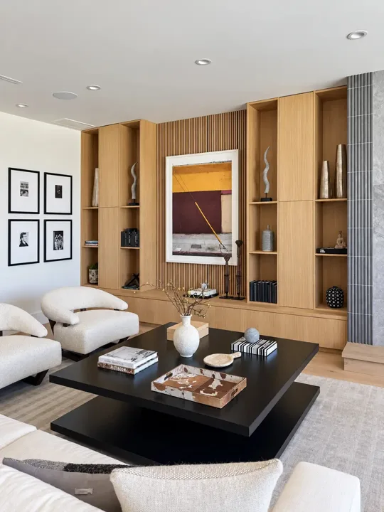 Wood-paneled living room with recessed shelving