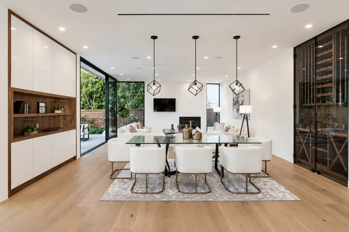 Dining room with glass pendant lights and sliding garden doors