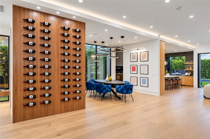 Wood wine display beside an open dining area