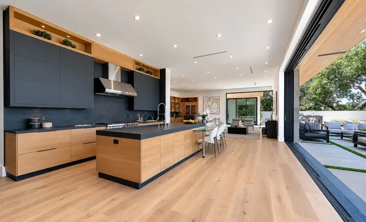 Long kitchen island opening to the living and dining areas
