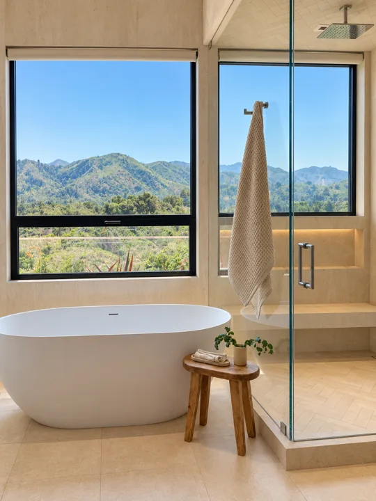 Freestanding tub with views of the surrounding hills