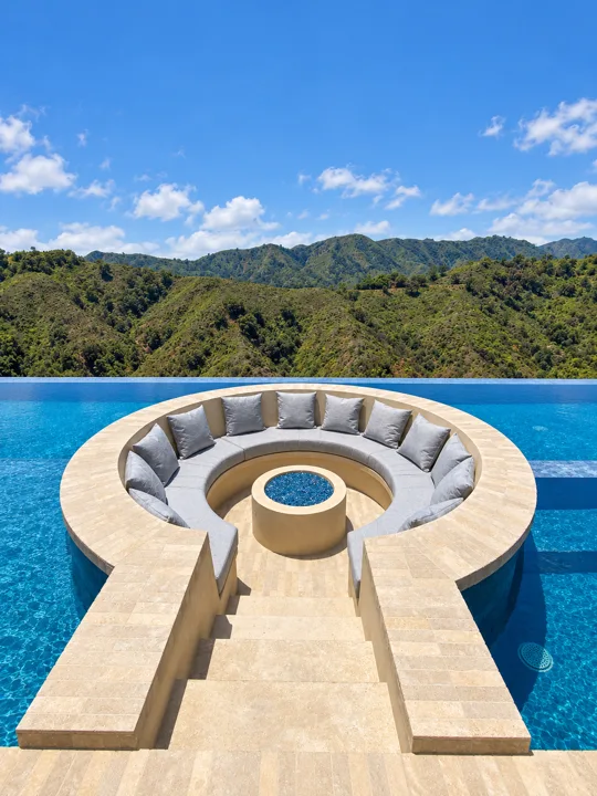 Circular outdoor seating set into a swimming pool