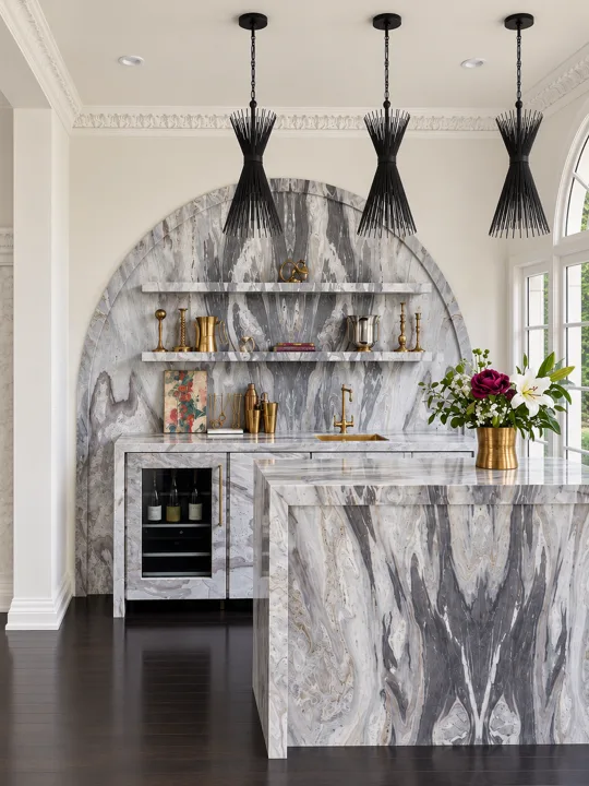 Dramatically veined marble bar beneath an arched opening